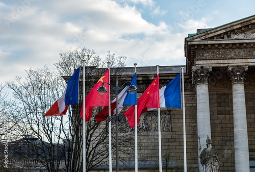 Paris, France: French and Chinese flags in the wind in front of National Assembly for Xi Jinping visite in france in March 2019 photo