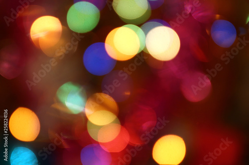 Abstract bokeh background, slightly blurry colored lights, festive city street © игорь перекрестоd