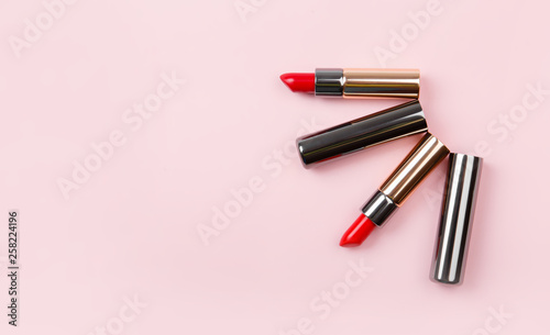 set of lipstick, lip gloss on pink background. Woman's cosmetics. Women's morning secrets. Cosmetics, lipstick. Make up collection