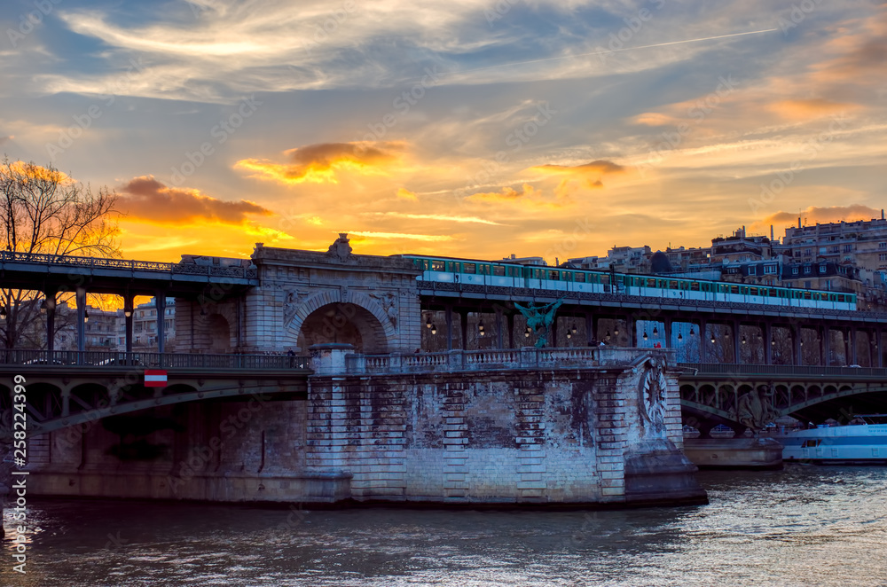 Paris, France: Sunset over Metro crossing Bir-hakeim bridge