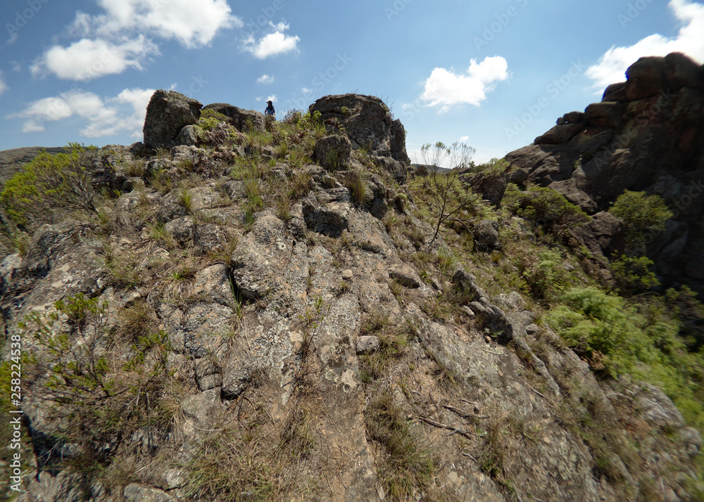 A hiker at Cerro Blanco reserve, near Tanti and Los Gigantes in the Altas Cumbres region, Cordoba, Argentina.