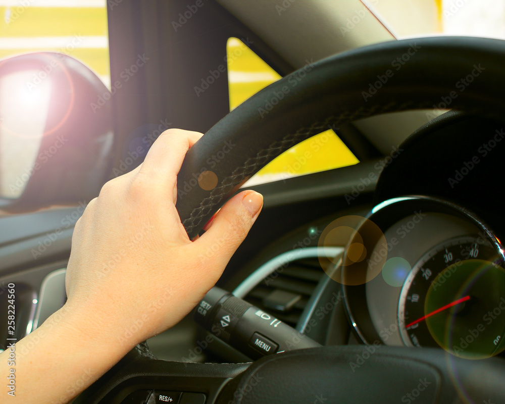 Close-up of Man Driving a Car Hand on Steering Wheel