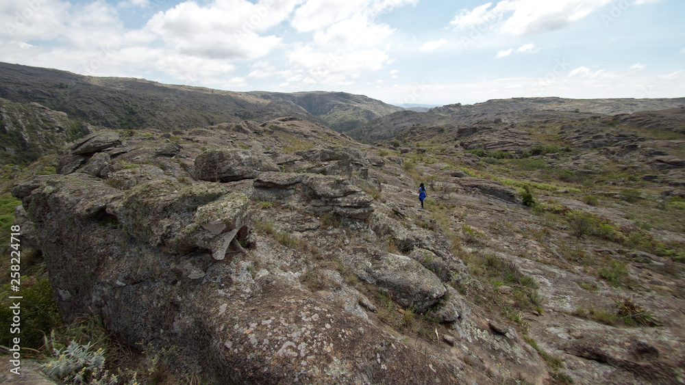 A hiker at Cerro Blanco reserve, near Tanti and Los Gigantes in the Altas Cumbres region, Cordoba, Argentina.