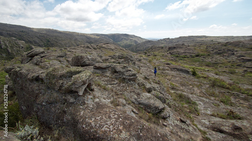 A hiker at Cerro Blanco reserve, near Tanti and Los Gigantes in the Altas Cumbres region, Cordoba, Argentina.