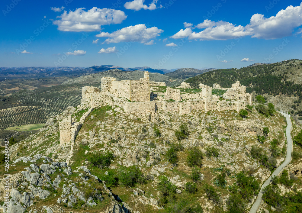 Moclin medieval walled town and ruined castle with blue sky aerial panorama