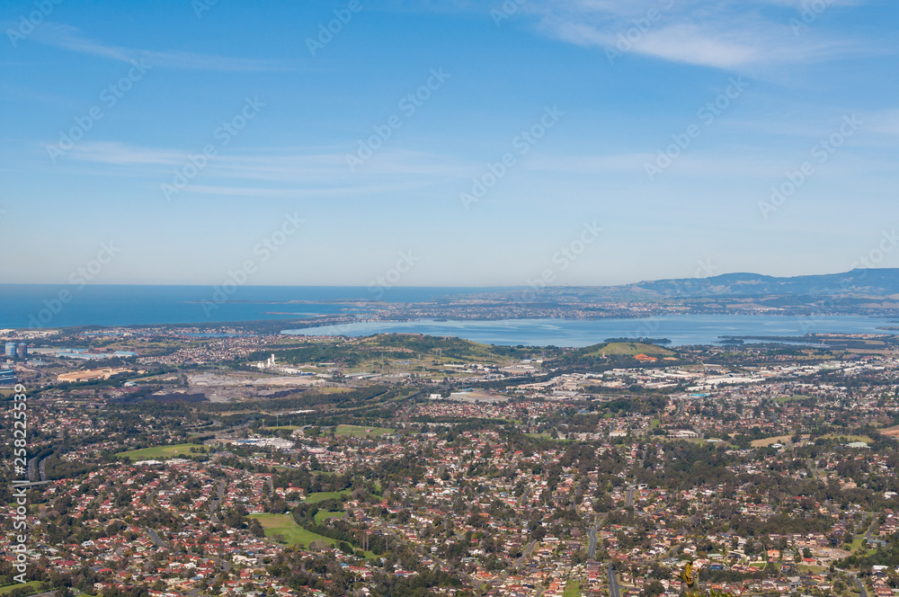 Fototapeta premium Aerial view of urban sprawl of Wollongong city in Australia
