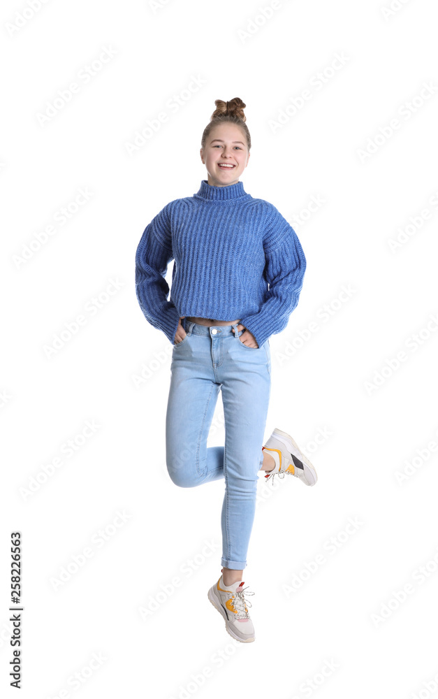 Pretty teenage girl jumping on white background Pretty teenage girl jumping on white background