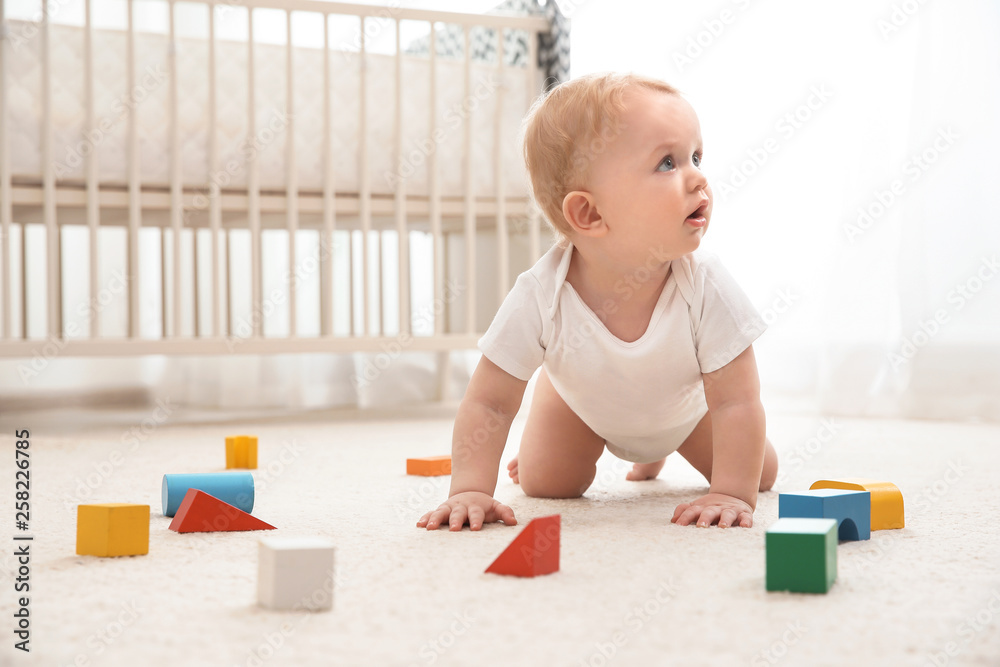 Cute little baby crawling on carpet indoors - obrazy, fototapety, plakaty 
