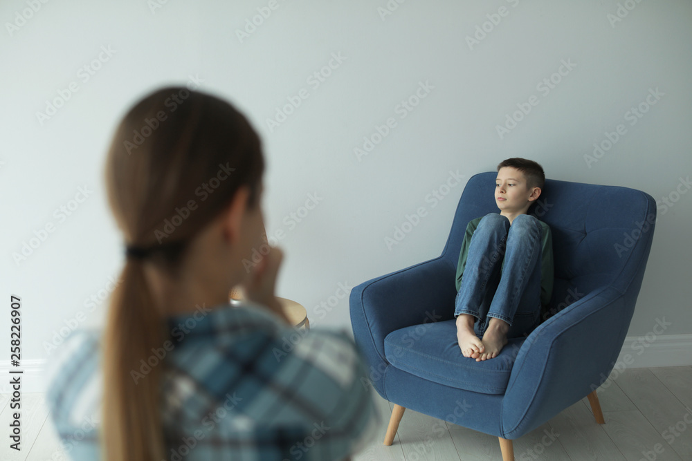Sad boy and his worried mother at home Sad boy and his worried mother at home