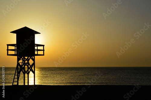 lifeguard tower at sunset