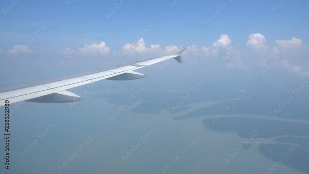 Dreamy feeling floating over clouds on a vacation, view from flight window perspective Dreamy feeling floating over clouds on a vacation, view from flight window perspective