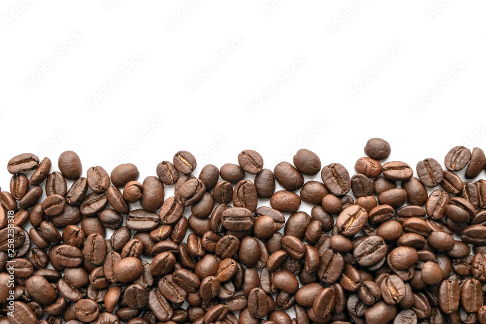 Roasted coffee beans isolated on white background. Close-up. Roasted coffee beans isolated on white background. Close-up.