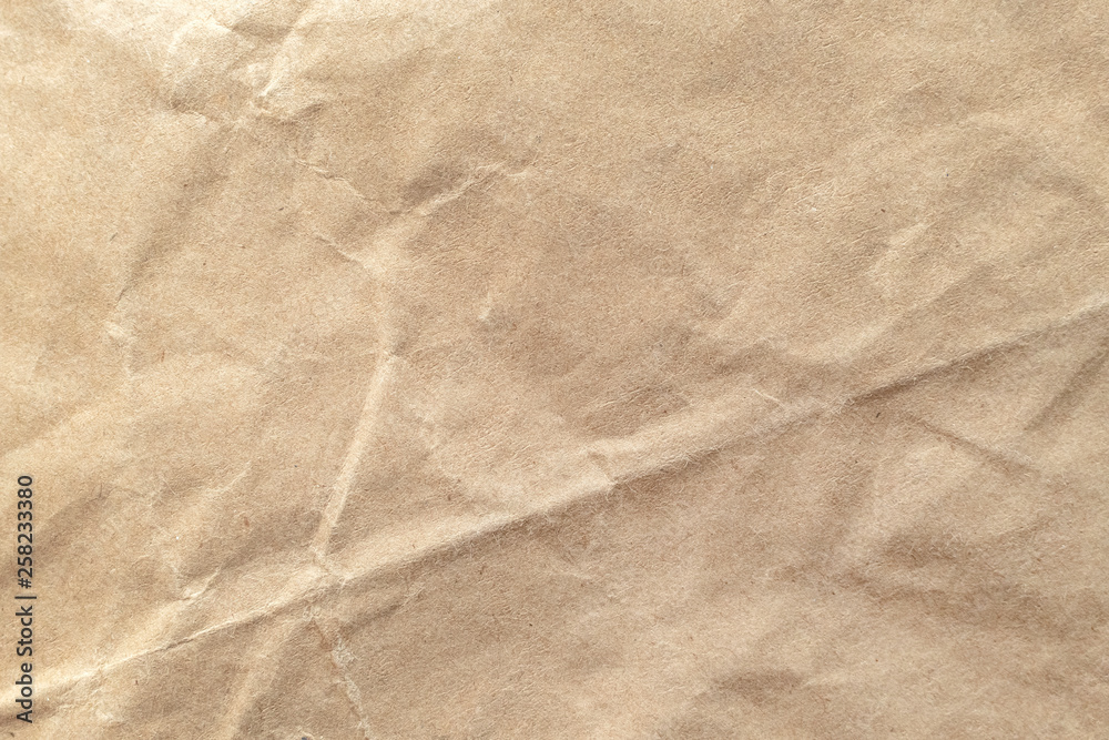 Fototapeta premium Brown crumpled paper texture background.