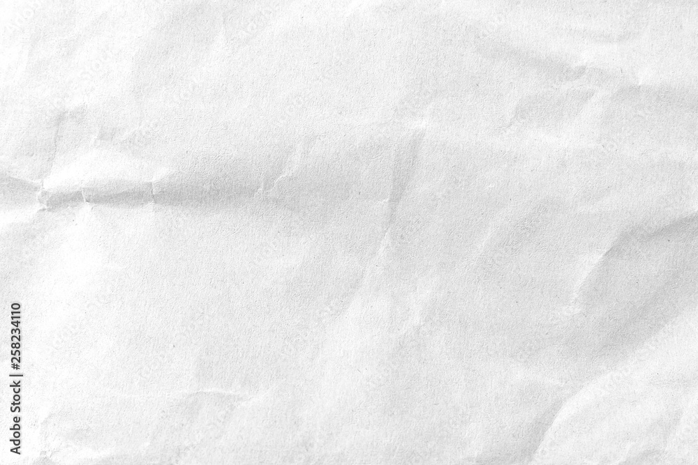 Naklejka premium White crumpled paper texture background. Close-up.