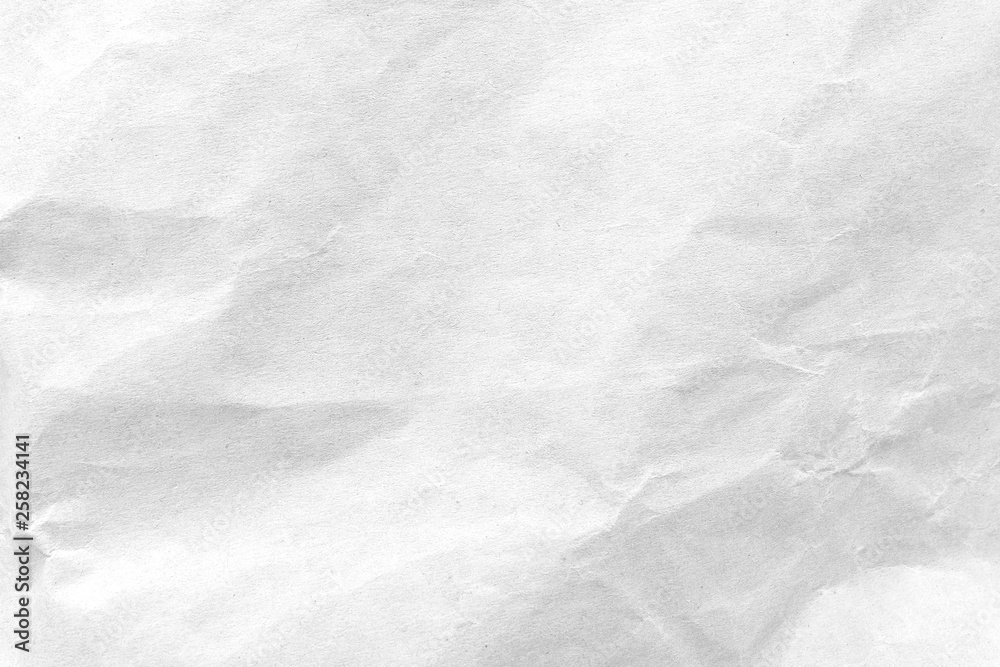 Obraz premium White crumpled paper texture background. Close-up.