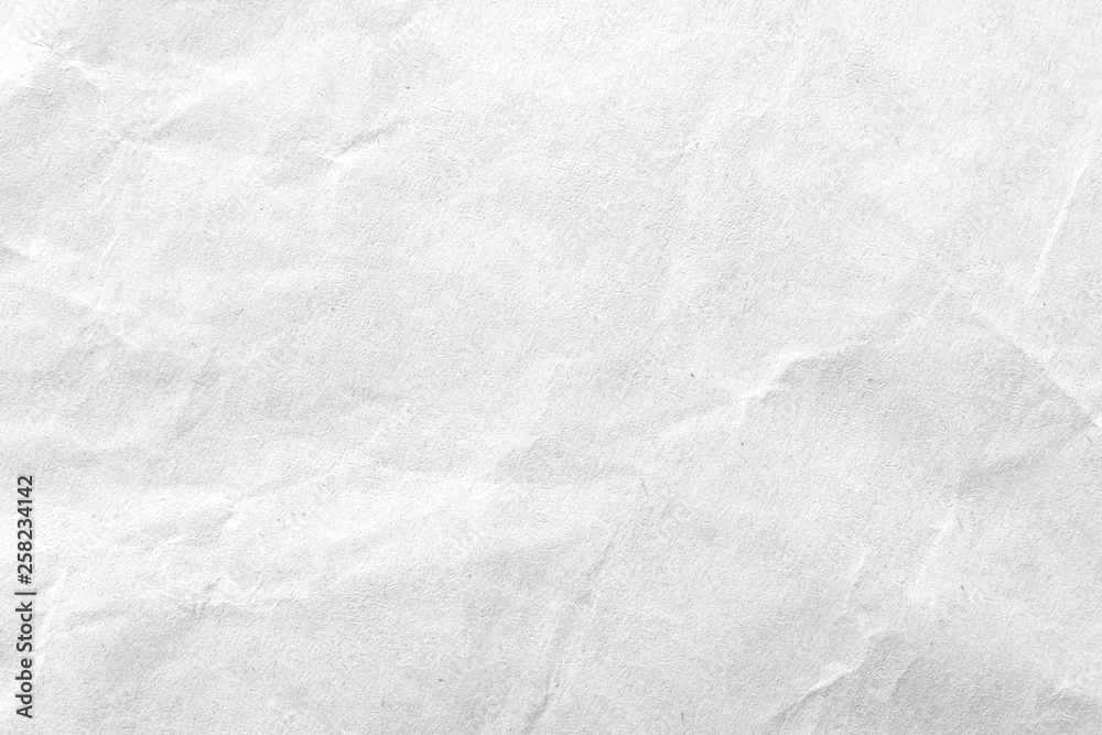 White crumpled paper texture background. Close-up. White crumpled paper texture background. Close-up.