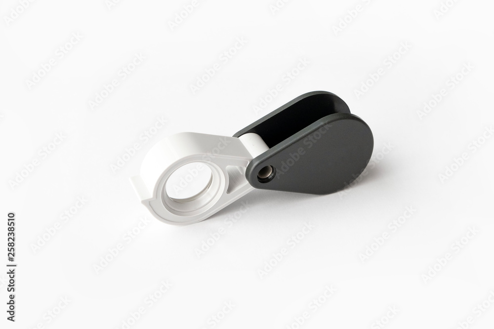 Magnifying glass for diamonds or see the amulet Isolated on a White Background. Magnifying glass for diamonds or see the amulet Isolated on a White Background.