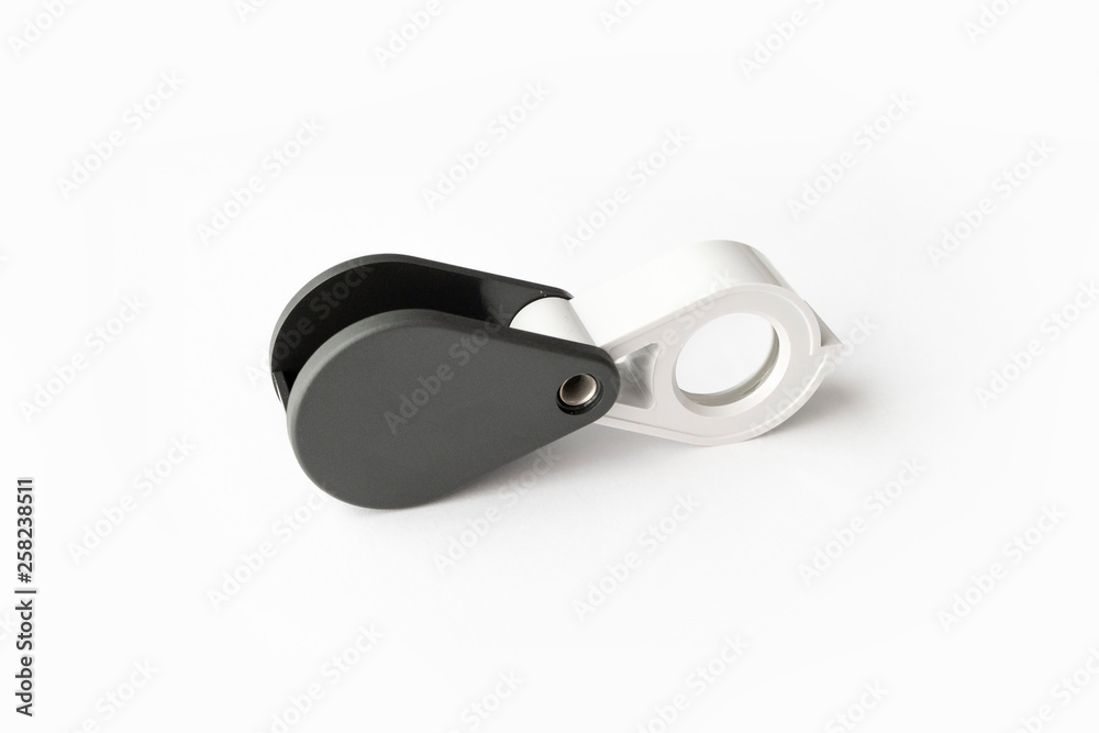 Magnifying glass for diamonds or see the amulet Isolated on a White Background. Magnifying glass for diamonds or see the amulet Isolated on a White Background.