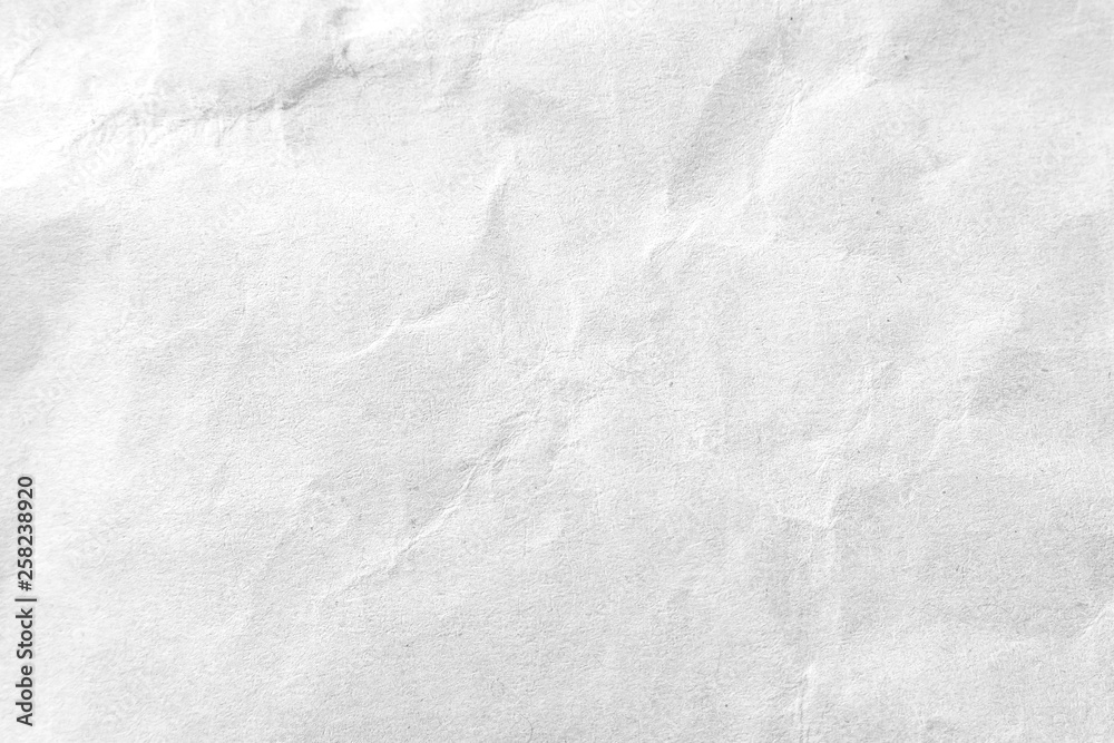 Naklejka premium White crumpled paper texture background. Close-up.