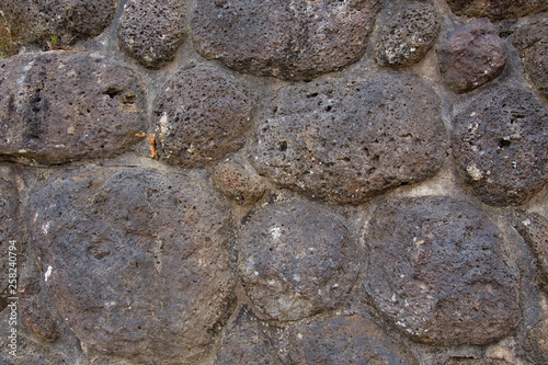 Weathered boulder, stone wall at Halloran's Hill Lookout Park near Atherton in Queensland, Australia