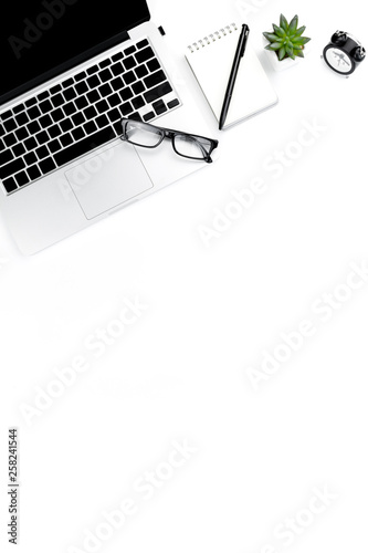 Creative flat lay photo of modern workplace with laptop, top view laptop background and copy space on white background, Above view shot of Computers on white background