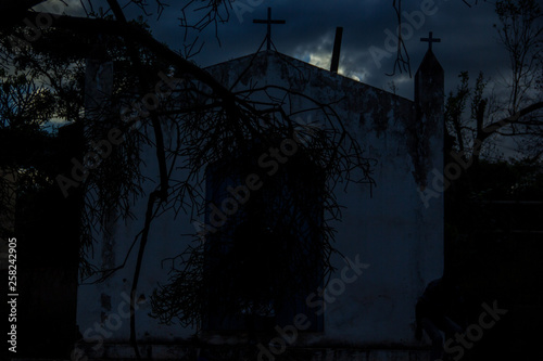 A small shady chapel with the light of rain, which threatened to fall in the sertao of Bahia, in Itaetê.