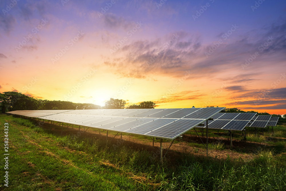 Solar panel on dramatic sunset sky background, Alternative energy concept