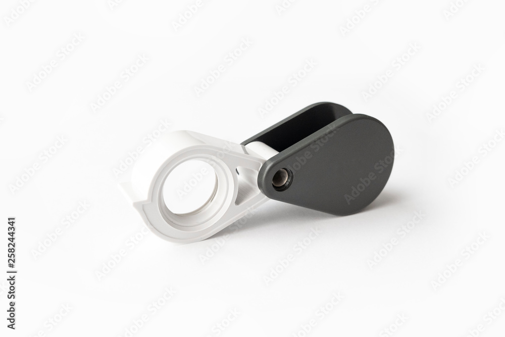 Magnifying glass for diamonds or see the amulet Isolated on a White Background. Magnifying glass for diamonds or see the amulet Isolated on a White Background.