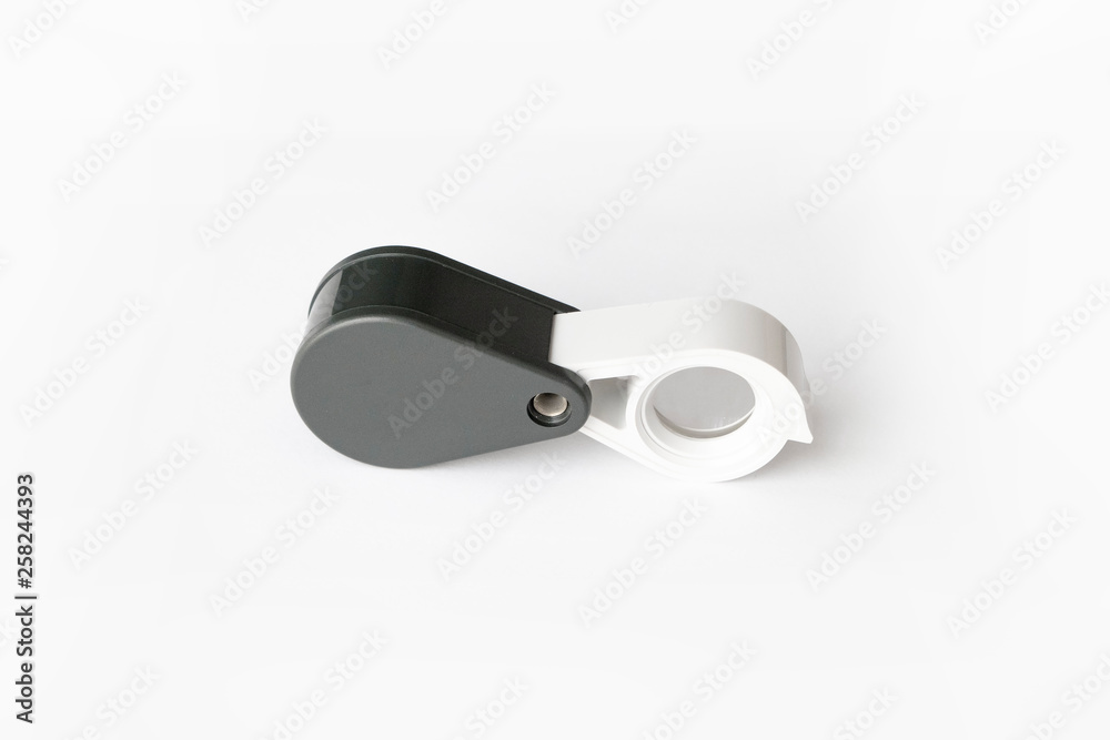Magnifying glass for diamonds or see the amulet Isolated on a White Background. Magnifying glass for diamonds or see the amulet Isolated on a White Background.