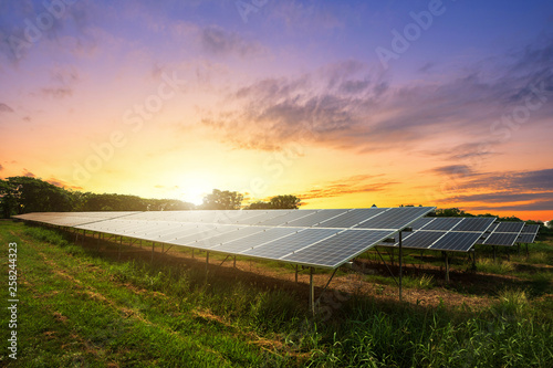Obraz na płótnie Solar panel on dramatic sunset sky background, Alternative energy concept w salonie