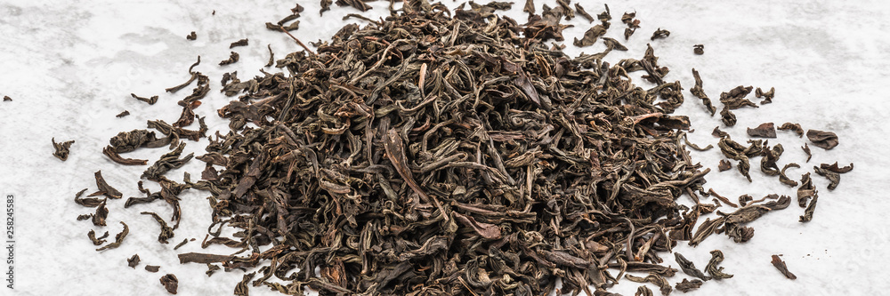 Dried tea is piled on a marble table. Dried tea is piled on a marble table.
