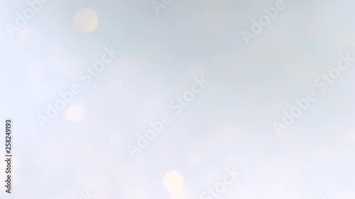 Defocused silver and white lights and bokeh effect. Motion and blinking showy gradient abstract background.