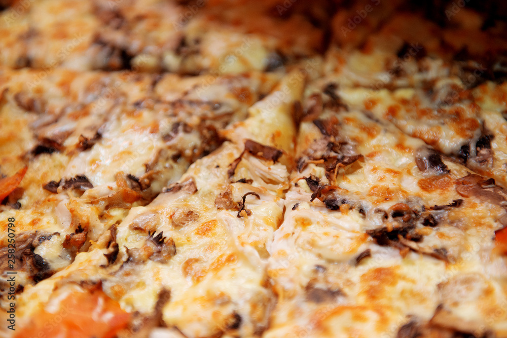 Delicious pizza with mushrooms and cheese close-up. Delicious pizza with mushrooms and cheese close-up.
