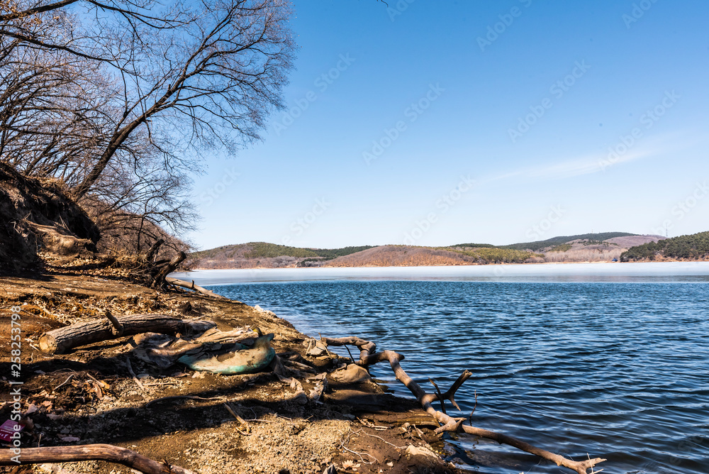 Changchun Jingyuetan National Forest Park with melting snow and ice