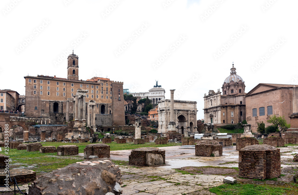 Roman forum ruins, buildings on Capitol hill in Rome