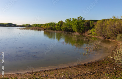 Pond in spring steppe as background