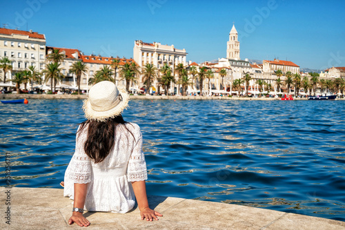 Woman traveler travel to old town of Split in Dalmatia, Croatia. Split is the famous city and top tourism destination of Croatia and Europe. photo