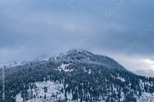 Snow Covered Himalayan Mountain Peak Against Cloudy Sky In Manali, Himachal Pradesh