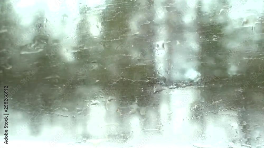 Watching the moving landscape from a muddy car window. The vehicle is traveling through a frozen landscape in the polar arctic circle. Watching the moving landscape from a muddy car window. The vehicle is traveling through a frozen landscape in the polar arctic circle.