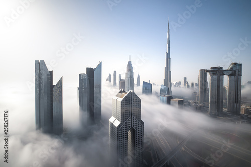Print op canvas Cityscape of Dubai Downtown skyline on a foggy winter day