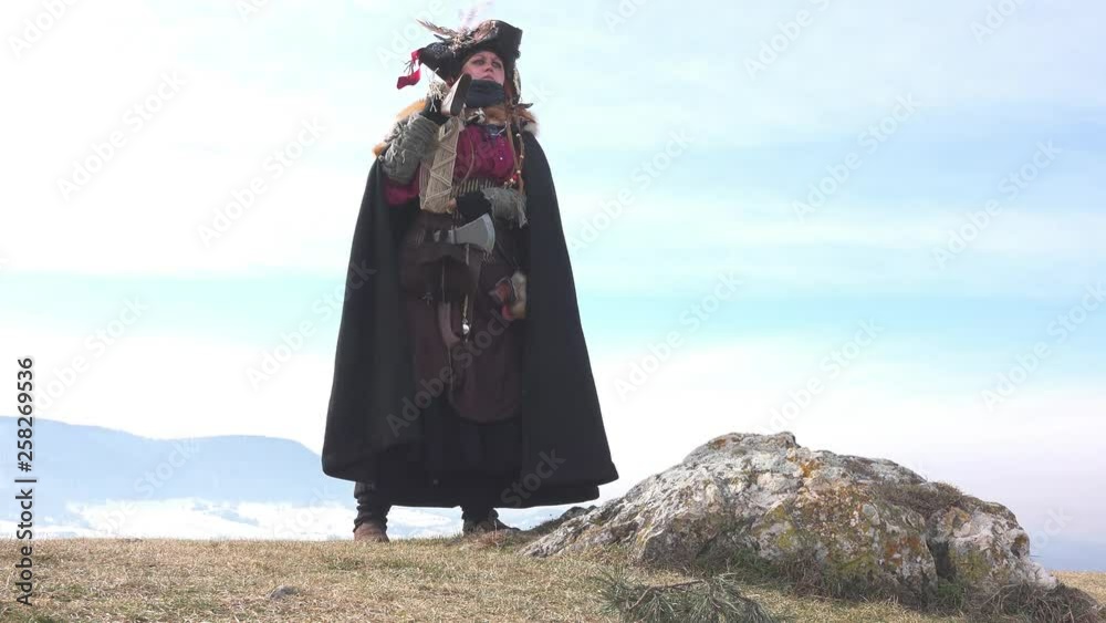 Female Hunter turning around on mountain Female Hunter turning around on mountain