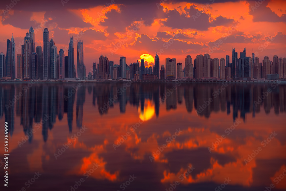 Cityscape of many skyscrapers in Dubai city at popular residential part of town known as Marina and JBR towards idyllic sunrise. - obrazy, fototapety, plakaty 