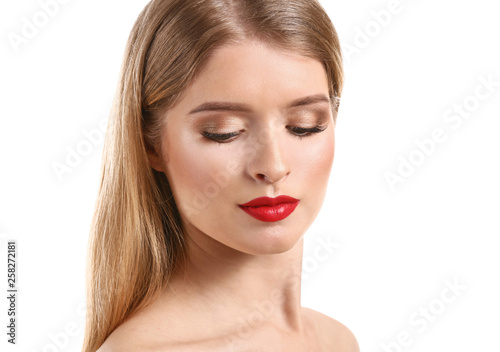 Beautiful young woman with bright makeup on white background