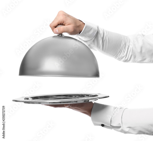 Waiter with tray and cloche on white background photo