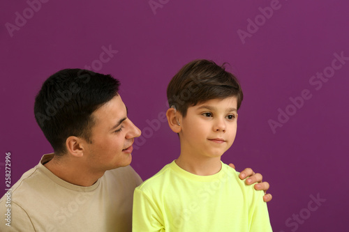 Young man and his son with ...