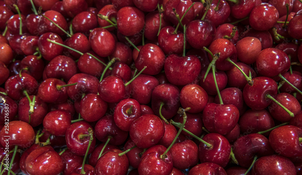 Cherries on display for sale at a afrmer's market Cherries on display for sale at a afrmer's market