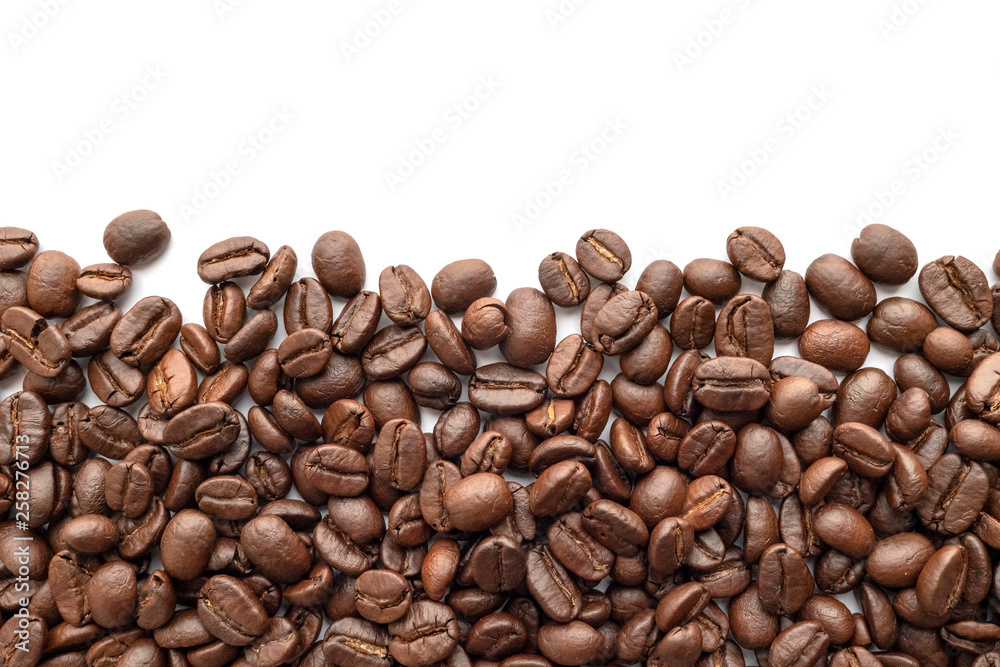 Roasted coffee beans isolated on white background. Close-up. Roasted coffee beans isolated on white background. Close-up.