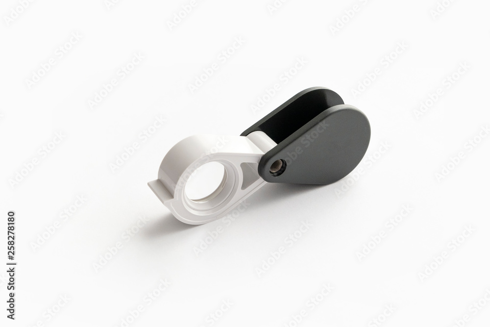 Magnifying glass for diamonds or see the amulet Isolated on a White Background. Magnifying glass for diamonds or see the amulet Isolated on a White Background.