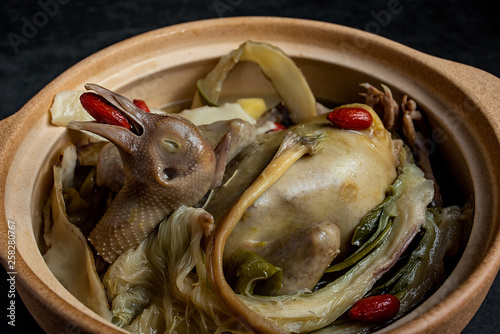 Chinese health soup Jianhua Yuzhu stewed pigeon soup photo