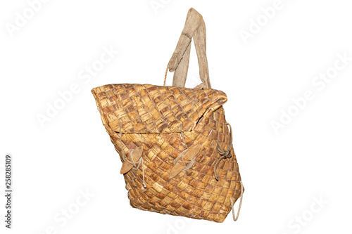 Ancient hunter's backpack from birch bark isolated on white background
